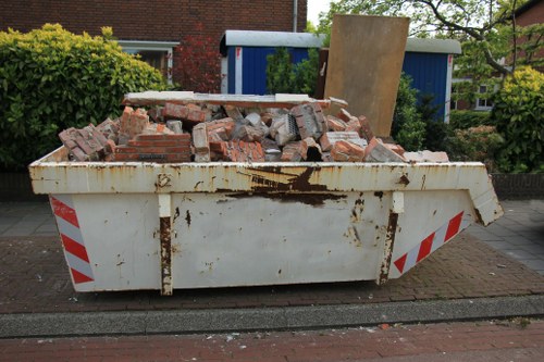 Van parked outside a terraced house ready for garden clearance in Whitechapel