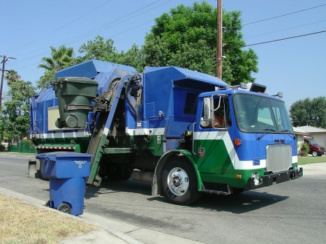 Team beginning a garden clearance job with equipment