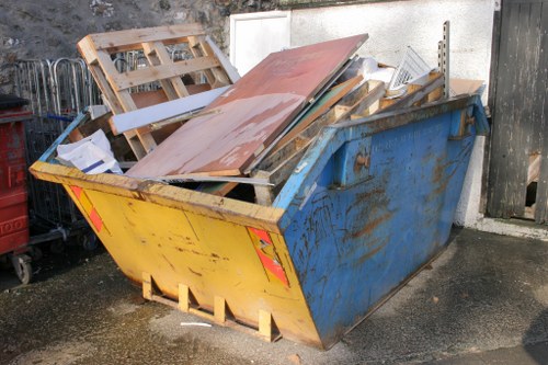 A team of professionals clearing out old furniture from a Whitechapel home